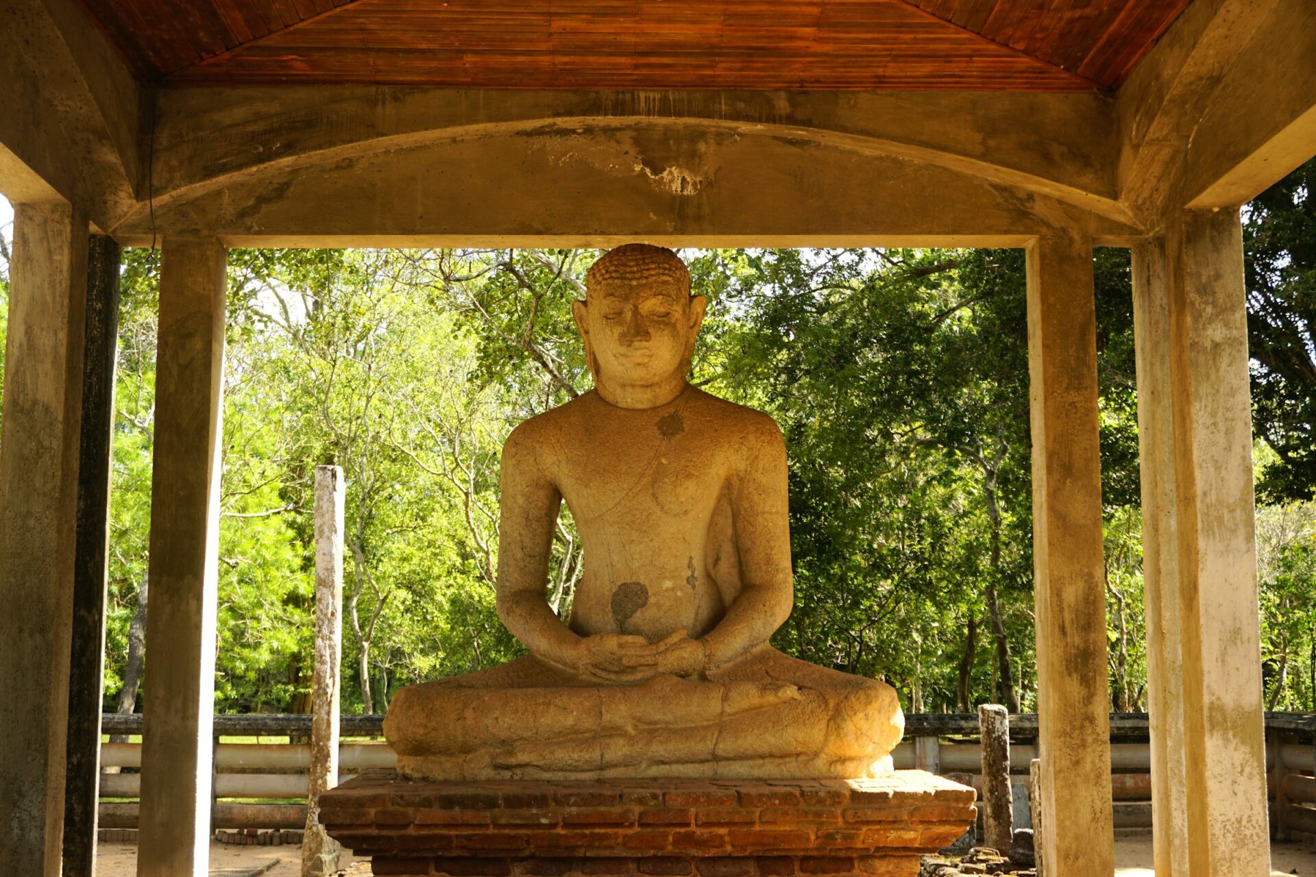 Ancient Buddha statue in the sacred city of Anuradhapura