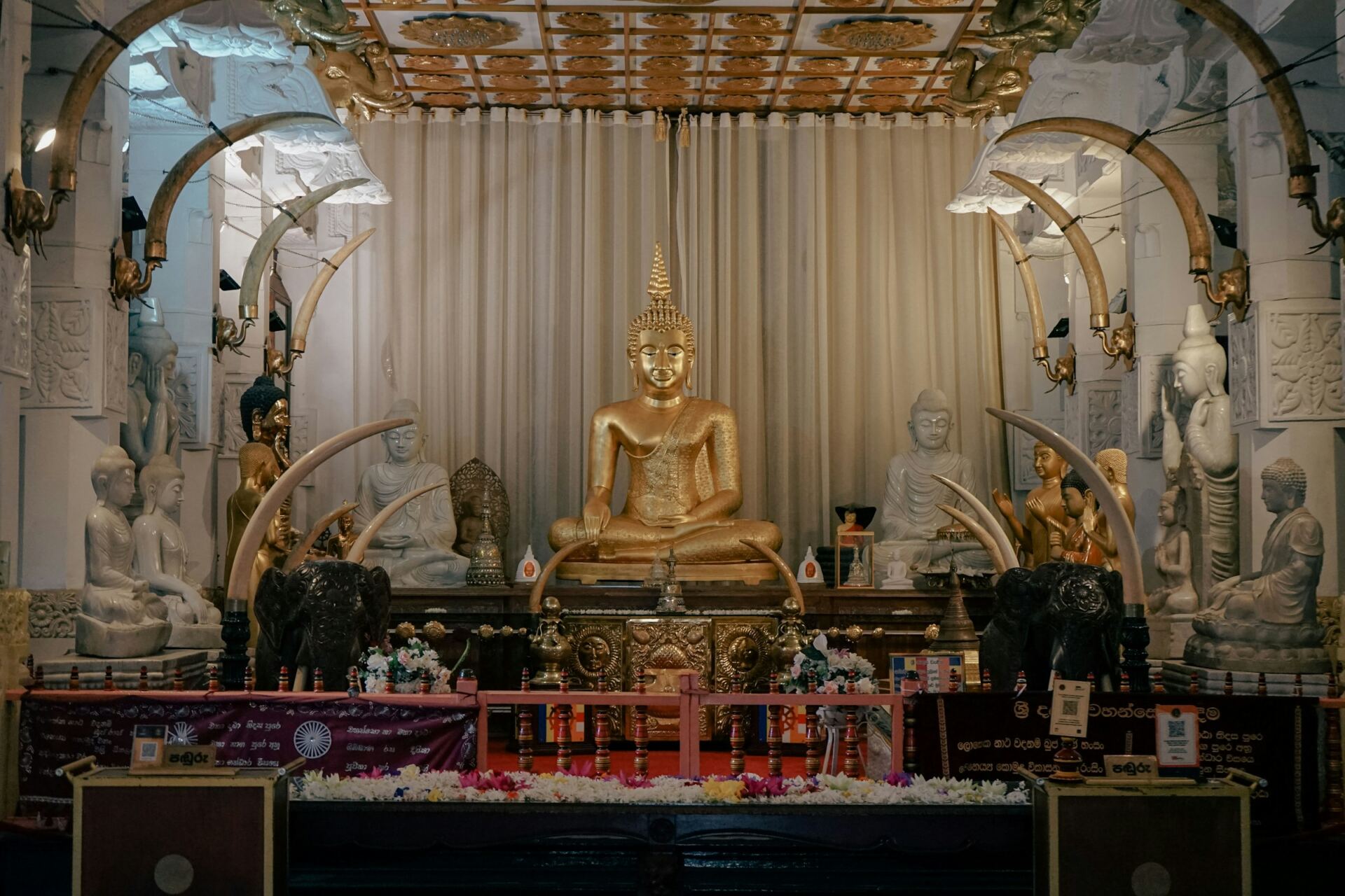 Golden Buddha and traditional interior in Kandy