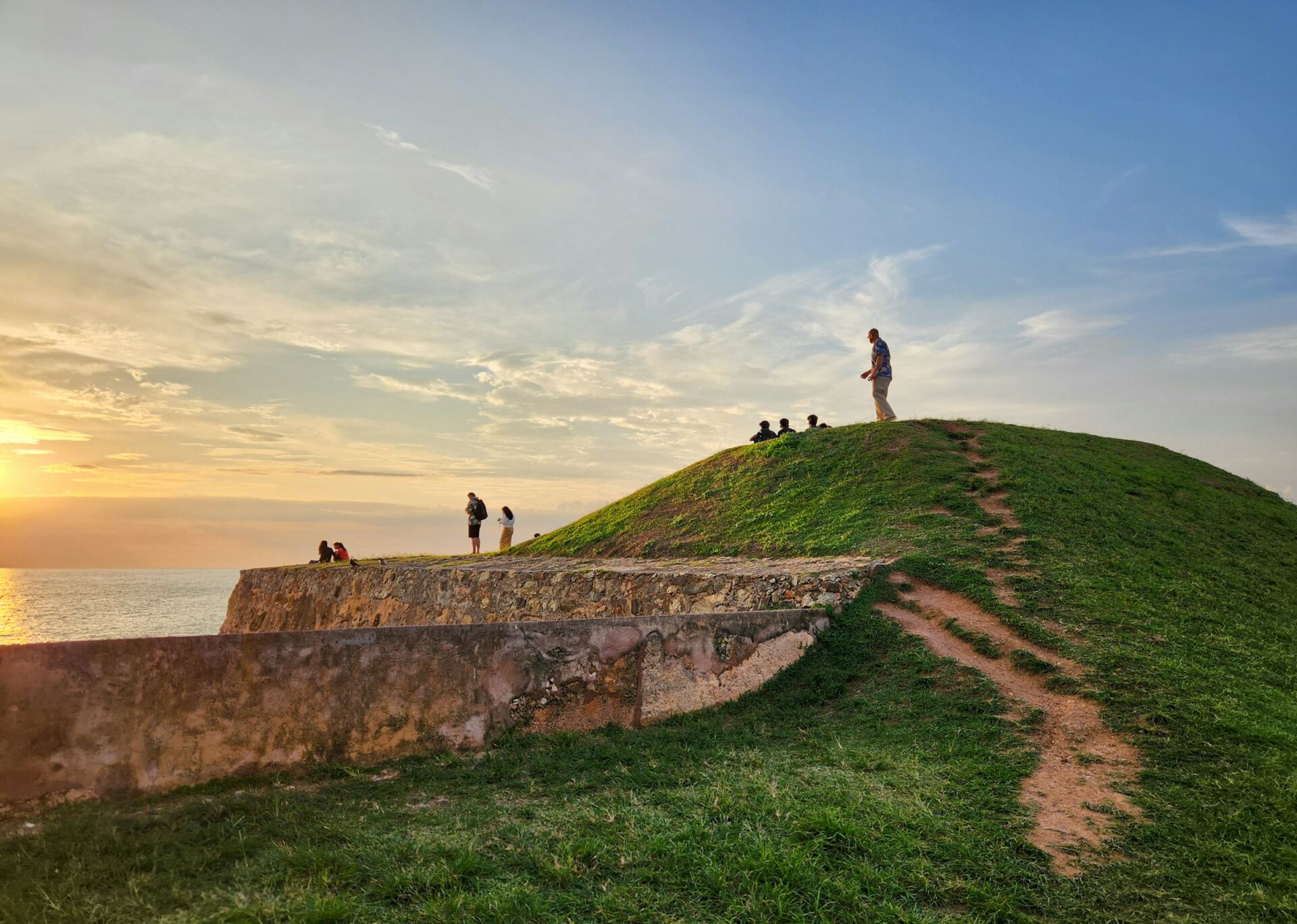 People enjoying sunset on the Galle Fort ramparts